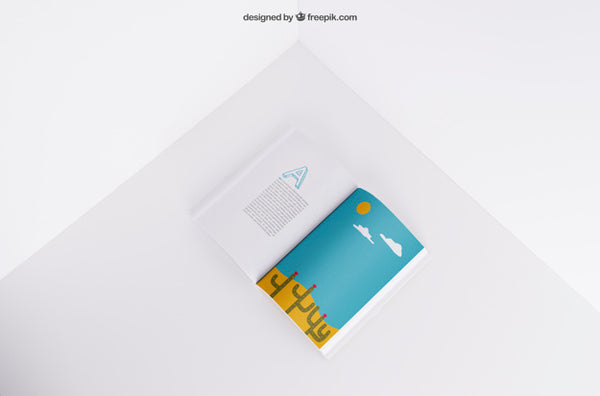 Free Top View Of Open Booklet In Corner Psd