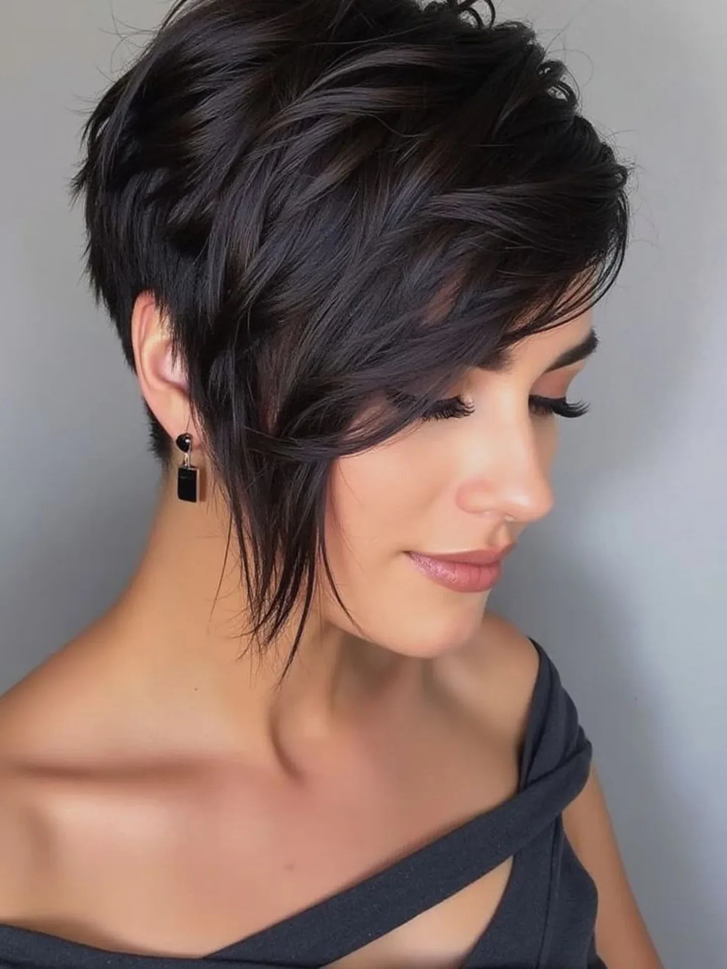 https://dreambundles.com/cdn/shop/articles/13.-dark-layered-pixie-with-long-fringe---side-swept-pixie.webp?v=1759711403