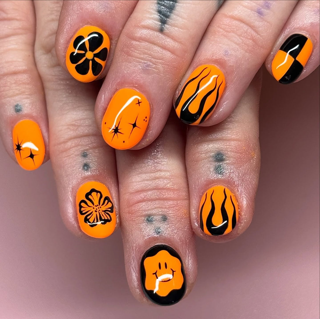 15 Black and Orange Nail Ideas to Try in 2026