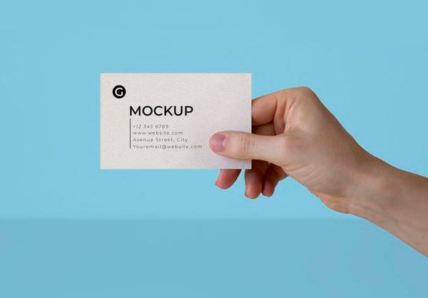 Free A Hand Holding A Business Card Mockup Psd