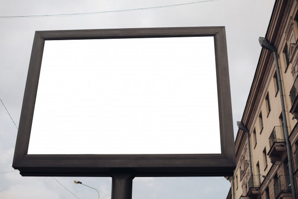 Free A Large Billboard With Interesting Information And Advertising On It Installed Along A Wide Street In The City Center Psd