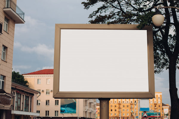 Free A Large Billboard With Interesting Information And Advertising On It Installed Along A Wide Street In The City Center Psd