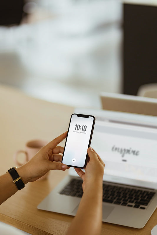 Free A Man Checking Date And Time On A Phone