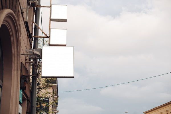 Free A Medium-Sized Billboard On A City Street Attracts Attention, Mockup Psd