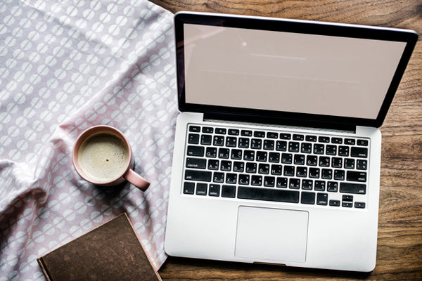 Free Aerial View Of Computer Laptop On Wooden Table And A Cup Of Hot Milk Psd