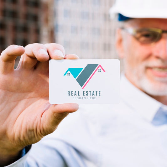 Free Architect Holding A Business Card Mock-Up Psd