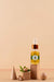 Free Argan Oil Cosmetic Bottle Mock-Up With Wooden-Shaped Podium And Kernels Psd
