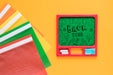 Free Arrangement With Green Board And Multicoloured Plastic Folders Psd