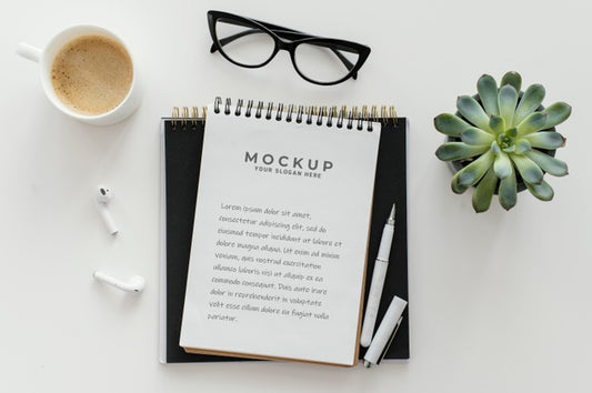 Free Arrangement With Mock-Up Notepad On A Desk Psd