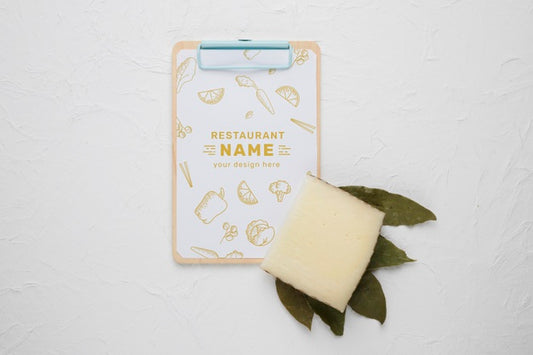 Free Assortment Of Delicious Cheese With Clipboard Mock-Up Psd