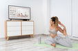 Free Athletic Woman Doing Yoga At Home Psd