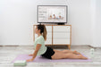 Free Athletic Woman Doing Yoga At Home Psd