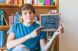 Free Back To School Concept With Boy Showing Slate Psd