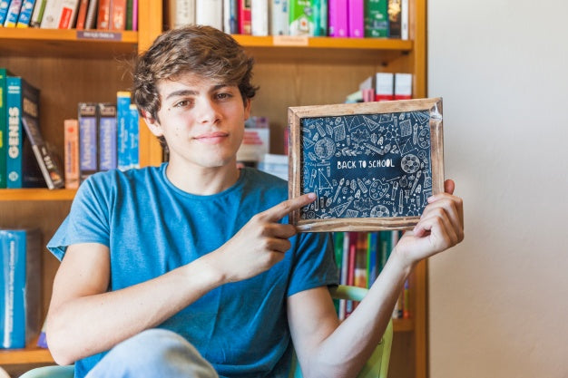 Free Back To School Concept With Boy Showing Slate Psd