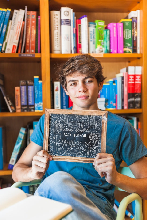 Free Back To School Concept With Boy Showing Slate Psd