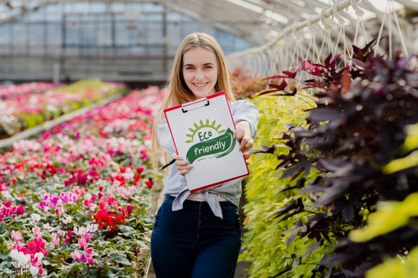 Free Beautiful Young Girl Holding Eco Friendly Sign Psd