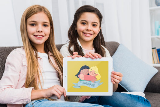 Free Best Friends Holding A Tablet Mock-Up Psd