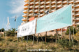 Free Billboard Mockup In Front Of Tall Building Psd