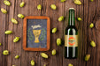 Free Bottle Of Beer With Sign Along On Table Psd