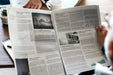 Free Business People Reading Newspaper