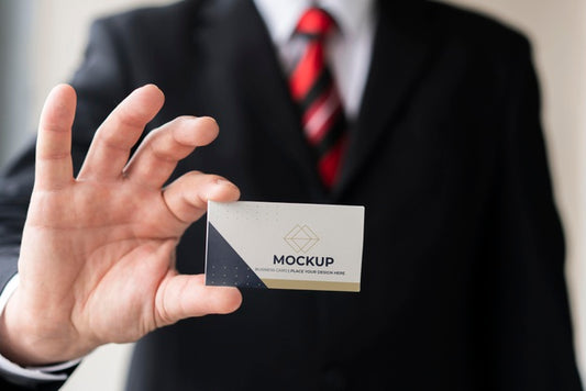 Free Businessman Holding Business Card Mock-Up Psd