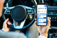 Free Businesswoman In Car Holding Phone Mockup Psd