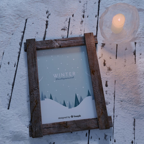 Free Candle Beside Frame With Winter Theme Psd