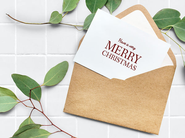 Free Card In An Envelope Mockup With Leaves In The Background