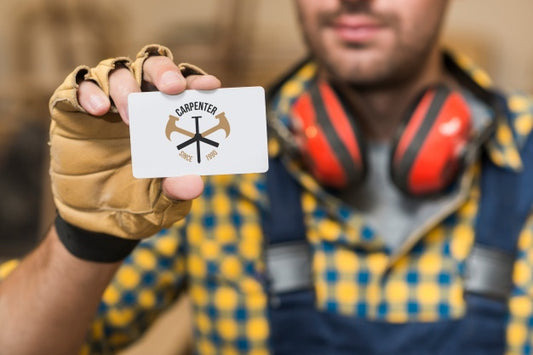 Free Carpenter Holding Business Card Mockup Psd