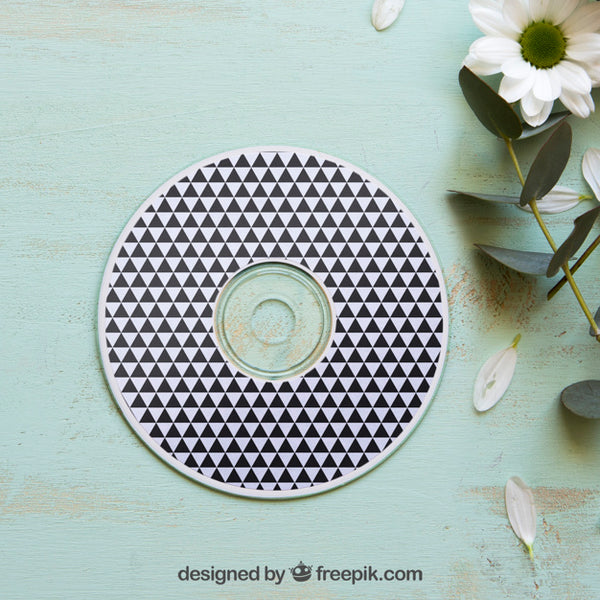 Free Cd Mockup Next To Flower Psd