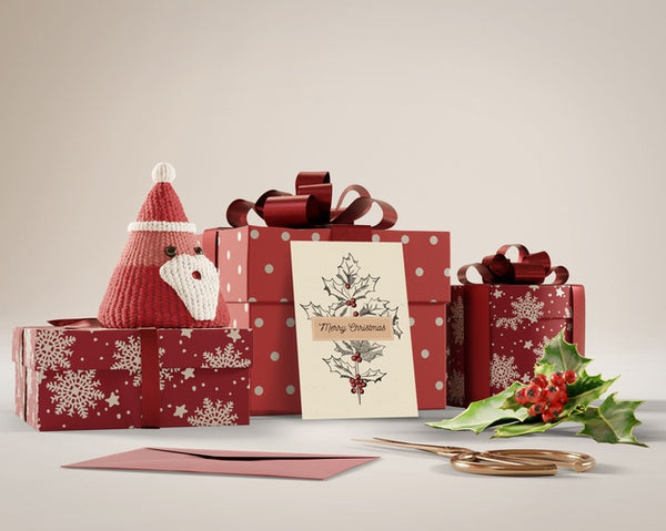 Free Christmas Card And Gifts On Table Psd