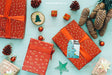 Free Christmas Mockup With Present Boxes And Pine Cones Psd
