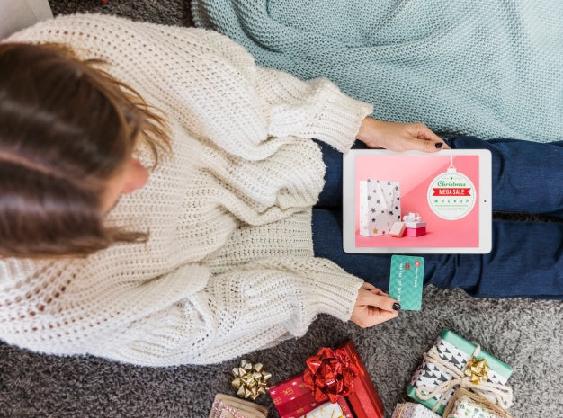 Free Christmas Sale Mockup With Woman Using Laptop Psd