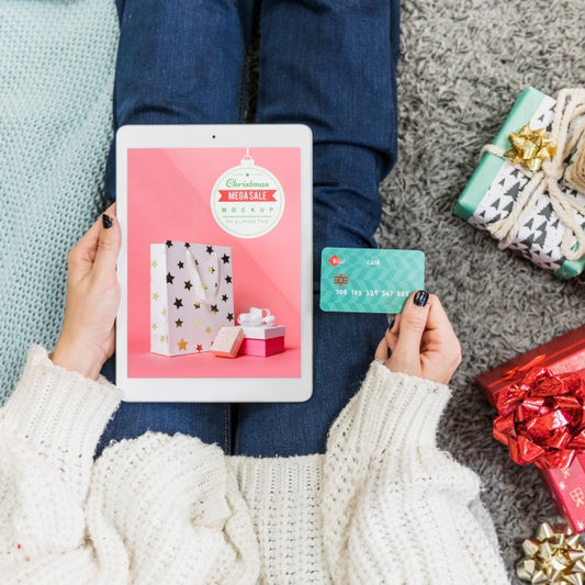 Free Christmas Sale Mockup With Woman Using Tablet Psd