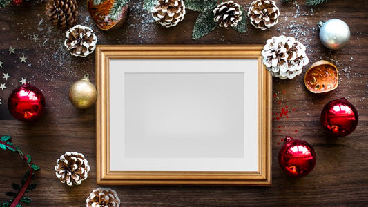 Free Classic Gold Frame Mockup With Christmas Decorations On Wooden Background Psd
