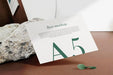 Free Clean Minimal A5 Flyer Mockup Floating On Top Wood Background With Leaves. Psd File. Psd