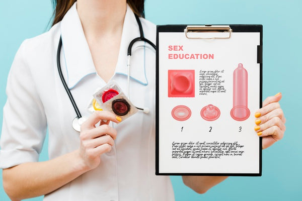Free Close-Up Doctor Holding Condoms Psd