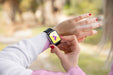 Free Close-Up Girl With Hoodie Looking At Smartwatch Psd