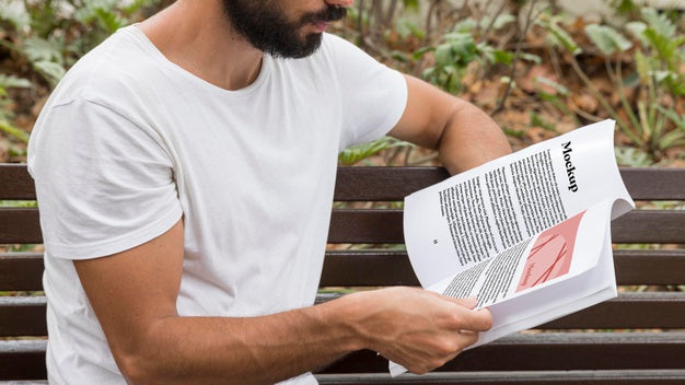 Free Close Up Man On Street Reading Book Psd