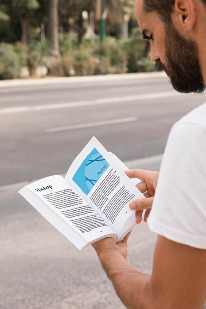 Free Close Up Man On Street Reading Book Psd