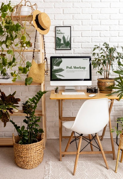 Free Close Up On Computer Mockup Surrounded By Plants Psd
