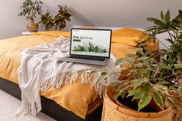 Free Close Up On Computer Mockup Surrounded By Plants Psd