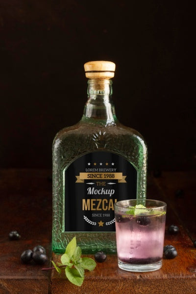 Free Close Up On Mezcal Drink Bottle With Ingredients Psd