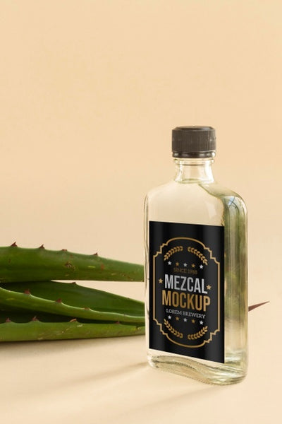 Free Close Up On Mezcal Drink Bottle With Ingredients Psd