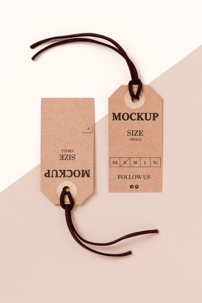 Free Clothing Size Tag Mock-Up On White And Pink Background Psd