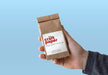 Free Craft Paper In Hand Mockup Psd