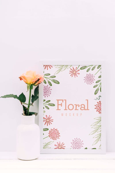 Free Desk Composition With Flower Decor And Frame Mockup Psd
