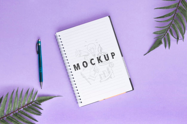 Free Desk Concept With Notebook And Pen On Table Psd