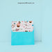 Free Envelope And Card Leaning Against Wall Psd
