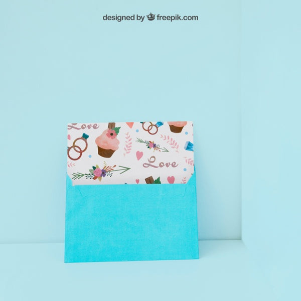 Free Envelope And Card Leaning Against Wall Psd